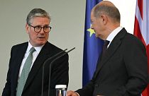 Britain's Prime Minister Keir Starmer, left, attends a joint news conference with German Chancellor Olaf Scholz, after talks at the Chancellery in Berlin, 28 August 2024