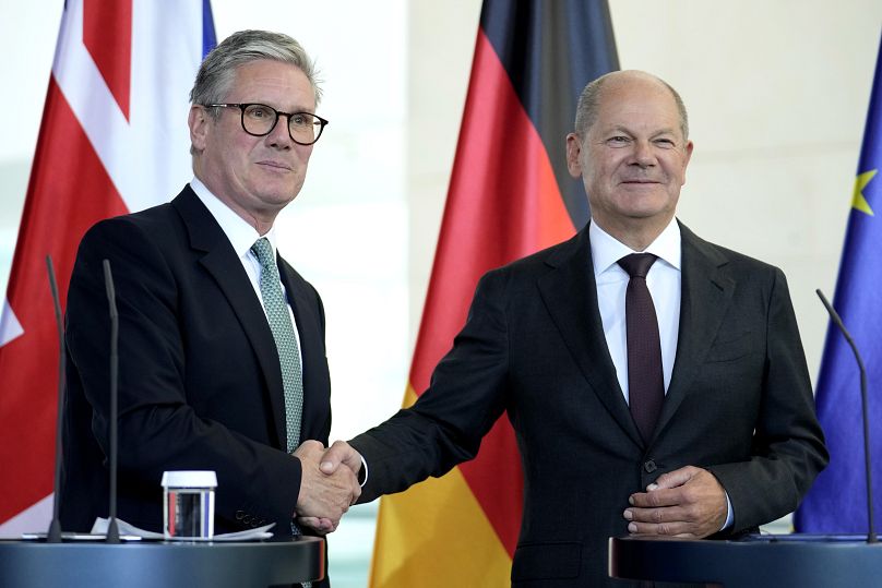 German Chancellor Olaf Scholz and UK Prime Minister Keir Starmer shake hands after a press conference in Berlin.