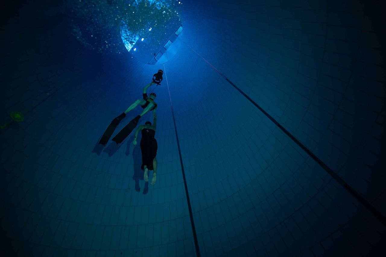 Freediver Christin Gerstorfer and safety diver use dive scooter to resurface. Wings in the Deep. 24 August, 2024. Warsaw, Poland.