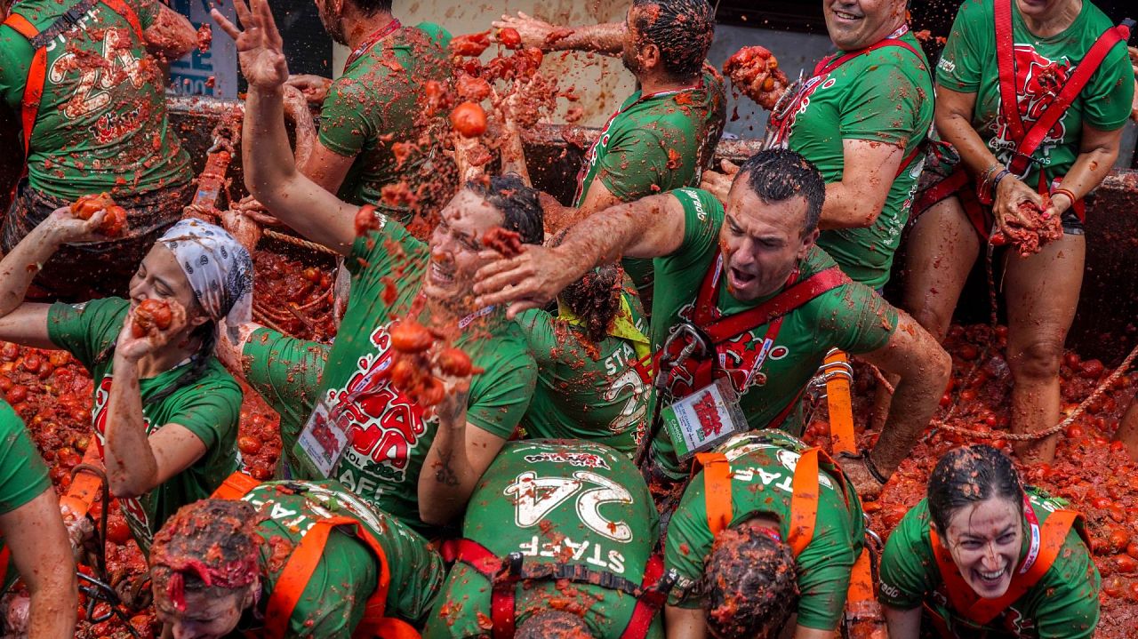 Revellers throw tomatoes at each other during the annual "Tomatina"