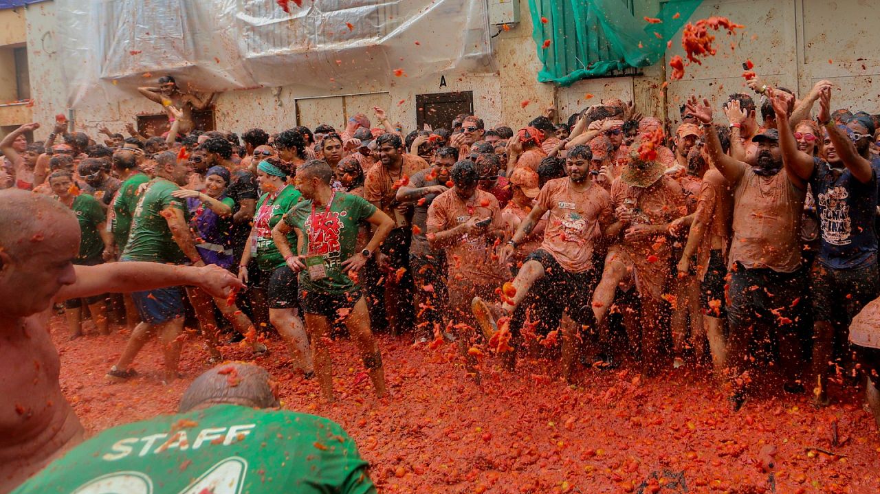 Revellers throw tomatoes at each other during the annual "Tomatina" 