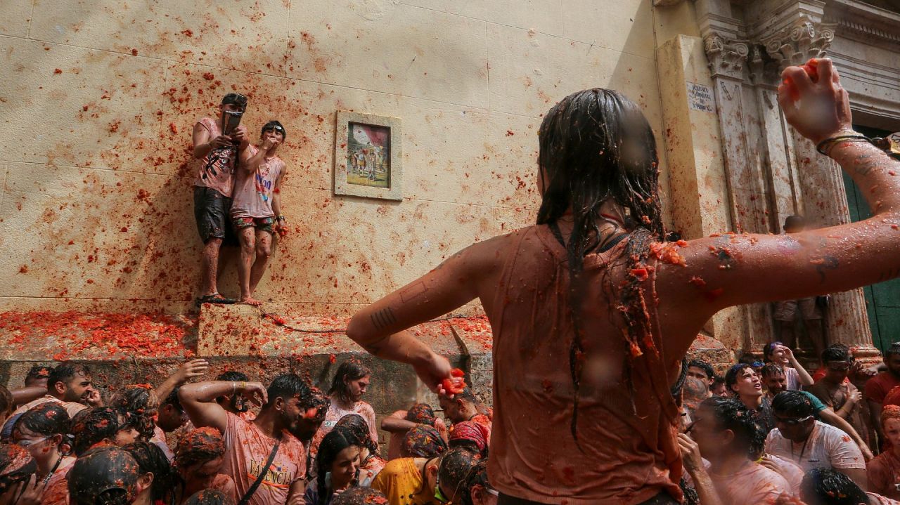 Revellers throw tomatoes at each other during the annual "Tomatina"