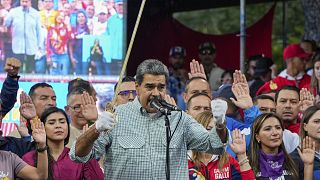 Venezuela's President Nicolás Maduro brandishes a sword as his new Cabinet takes the oath of office, at the presidential palace in Caracas, Venezuela, Wednesday, Aug. 28, 2024