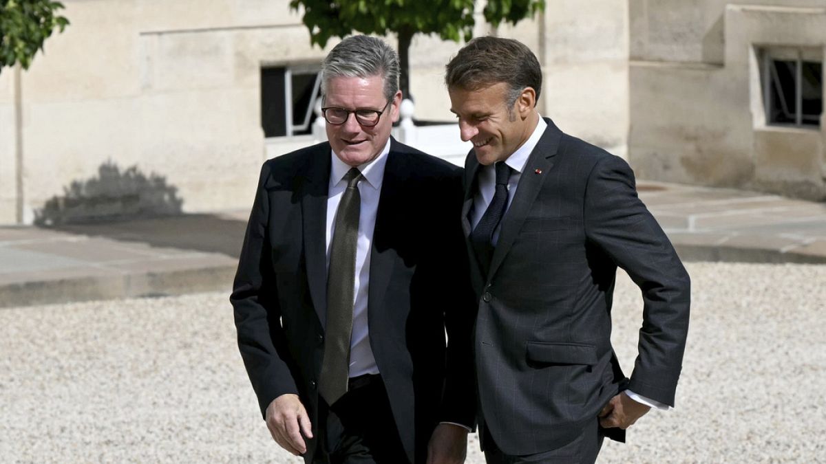 French President Emmanuel Macron welcomes Britain's Prime Minister Keir Starmer at the Elysee Palace in Paris. 