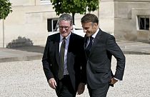 French President Emmanuel Macron welcomes Britain's Prime Minister Keir Starmer at the Elysee Palace in Paris. 