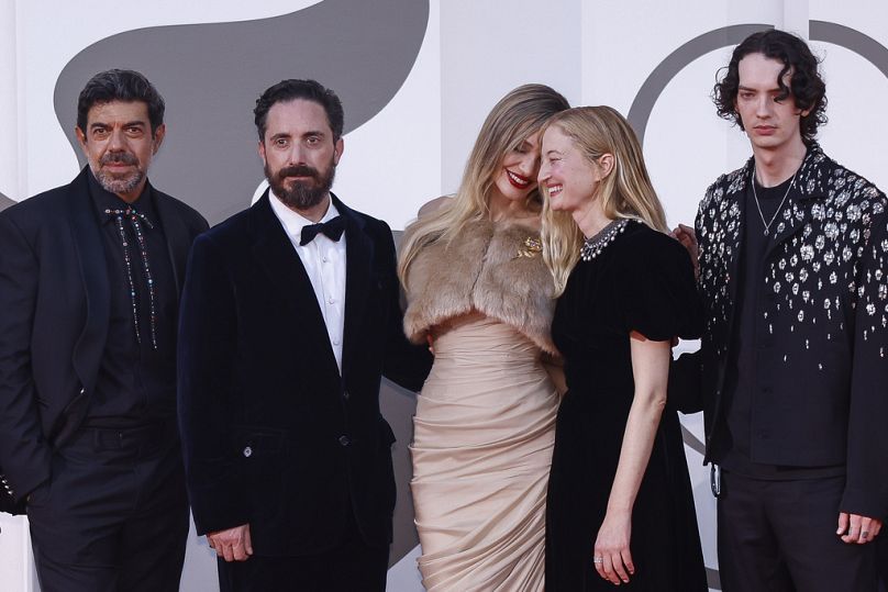 Pictures please? Pierfrancesco Favino, from left, director Pablo Larrain, Angelina Jolie, Alba Rohrwacher, and Kodi Smit-McPhee pose upon arrival for the premiere of 'Maria'