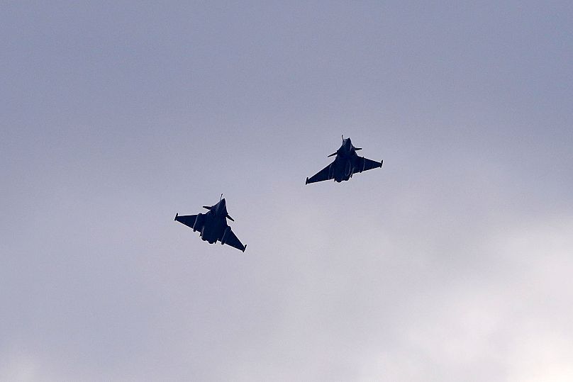 Two Rafale fighter jets fly after a signing ceremony between French President Emmanuel Macron and Croatia's Prime Minister Andrej Plenković in Zagreb, November 25, 2021