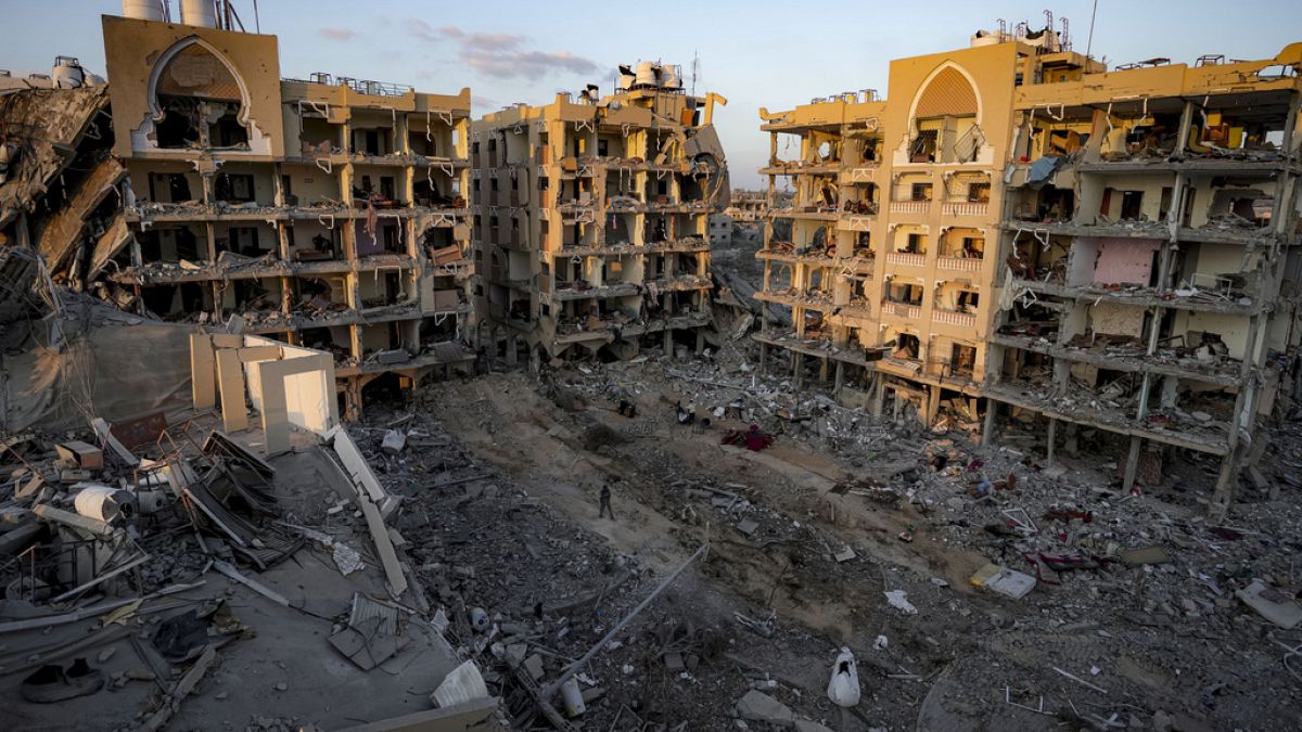 Palestinians inspect their houses after being destroyed byIsraeli bombardment on east of Deir al-Balah, Thursday, Aug. 29, 2024.