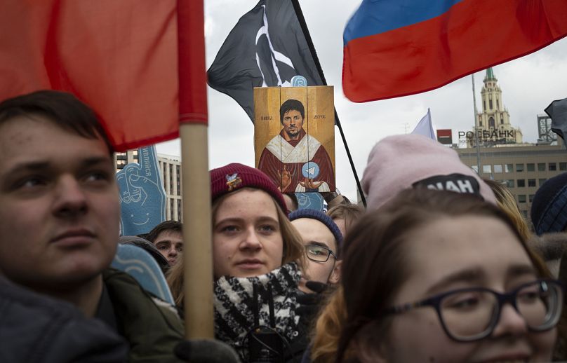 Demonstrators hold a portrait of messaging app Telegram co-founder Pavel Durov as an icon, during the Free Internet rally