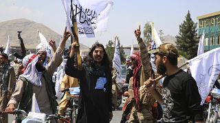 Taliban fighters celebrate the third anniversary of the withdrawal of US-led troops from Afghanistan, August 14, 2024