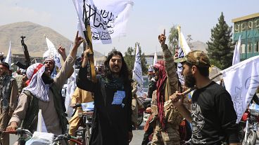 Taliban fighters celebrate the third anniversary of the withdrawal of US-led troops from Afghanistan, August 14, 2024