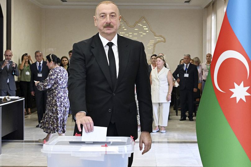 Azerbaijani President Ilham Aliyev casts his ballot at a polling station during a snap election in the Milli Mejlis parliament in Baku, Azerbaijan, Sunday, Sept. 1, 2024. 