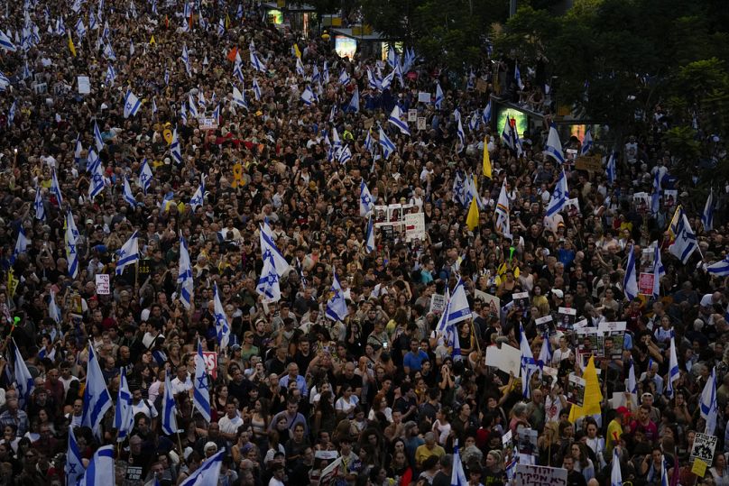 People take part in a protest calling for a deal for immediate release of hostages held in the Gaza Strip by the Hamas militant group, in Tel Aviv, Israel, Sunday, Sept. 1, 20