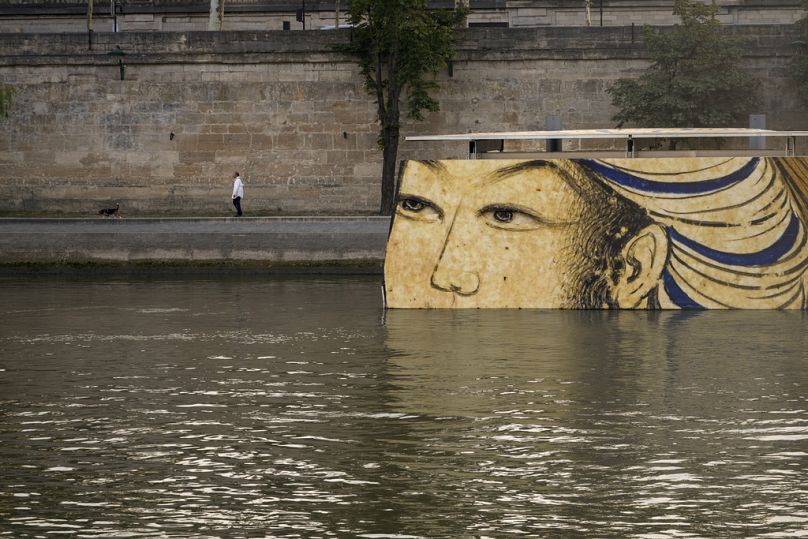 Reproductions of artworks decorate the banks of the River Seine at the 2024 Summer Olympics, Tuesday, July 30, 2024, in Paris, France. 