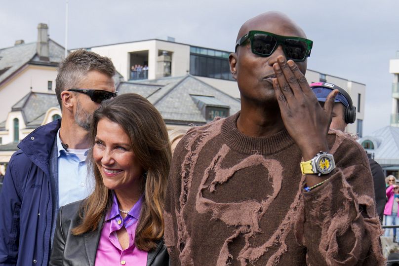 Norway's Princess Martha Louise and Durek Verret arrive at the boats in Alesund, Norway, Friday Aug. 30, 2024. that will transport them to Geiranger for their wedding.