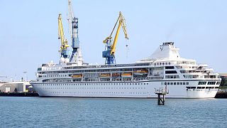 The Odyssey, a US cruise liner operated by Villa Vie Residences docked at Harland & Wolf ship repair facility in Belfast Harbour, Northern Ireland, 30 August 2024.