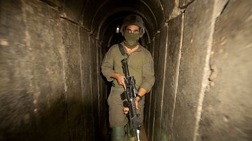 Israeli soldiers escort the media to an underground tunnel found underneath Shifa Hospital in Gaza City,