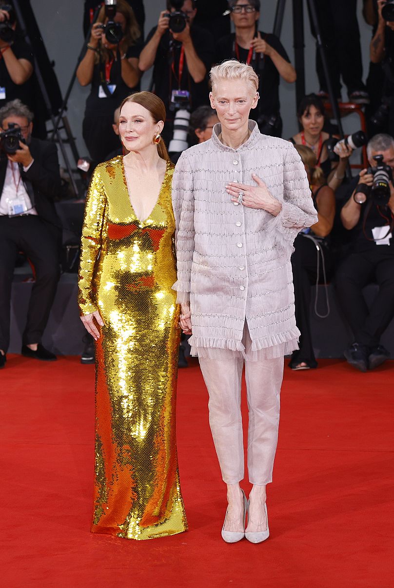 Julianne Moore, left, and Tilda Swinton pose for photographers upon arrival for the premiere of the film 'The Room Next Door' at the Venice Film Festival 