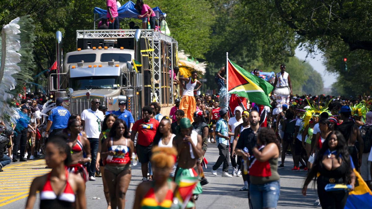 Participants take part in the West Indian American Day Parade in the Brooklyn borough of New York, Monday, Sept. 3, 2018.