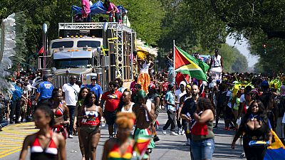 Participants take part in the West Indian American Day Parade in the Brooklyn borough of New York, Monday, Sept. 3, 2018.