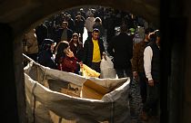 People walk along a street at Eminonu commercial area in Istanbul, Turkey. 7 February 2024.