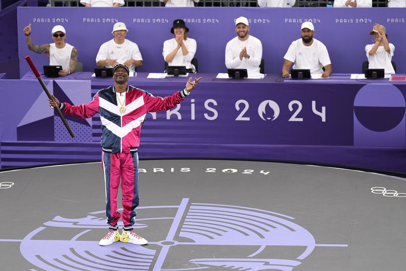 American artist Snoop Dogg performs a short dance on stage prior to the breaking competition at La Concorde Urban Park at the 2024 Summer Olympics