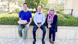 Australian Ambassador to Iran Ian McConville (centre) in the post on social media celebrating Australia's Wear Purple Day