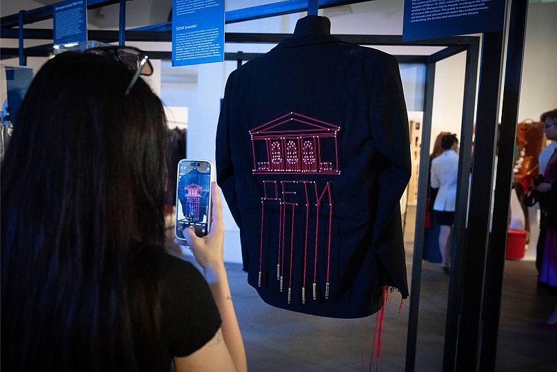 A black jacket created by designer Maria Starchak bears an embroidered design of the Mariupol drama theatre which was hit by an airstrike, in southern Ukraine.