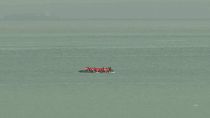 Migrants on an inflatable boat seen attempting to cross the English Channel and seen from ashore Wimereux, France, Wednesday, 4 September, 2024.