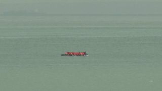 Migrants on an inflatable boat seen attempting to cross the English Channel and seen from ashore Wimereux, France, Wednesday, 4 September, 2024.