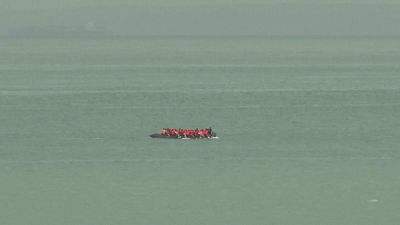 Migrants on an inflatable boat seen attempting to cross the English Channel and seen from ashore Wimereux, France, Wednesday, 4 September, 2024.