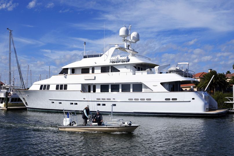 A small craft passes by Igor Makarov's 128-foot yacht, called Areti I docked at Camachee Cove Yacht Harbor marina, Thursday, Nov. 30, 2023, in St. Augustine, Fla. 