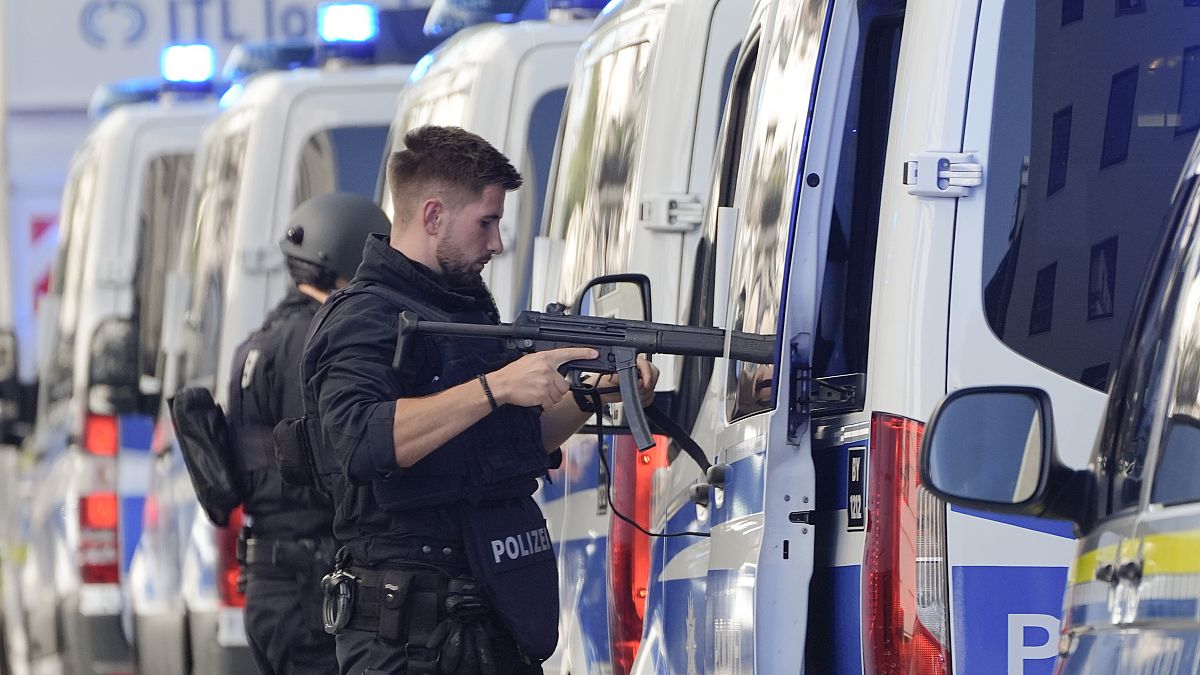 Police officers patrol near a scene after police fired shots at a suspicious person in Munich, Germany, Thursday, Sept. 5, 2024.