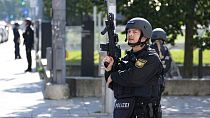 Police officers patrol near a scene after police fired shots at a suspicious person near the Israeli Consulate and a museum on the city's Nazi-era history in Munich, Germany