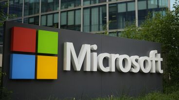 FILE - The Microsoft logo is displayed outside its French headquarters in Issy-les-Moulineaux.