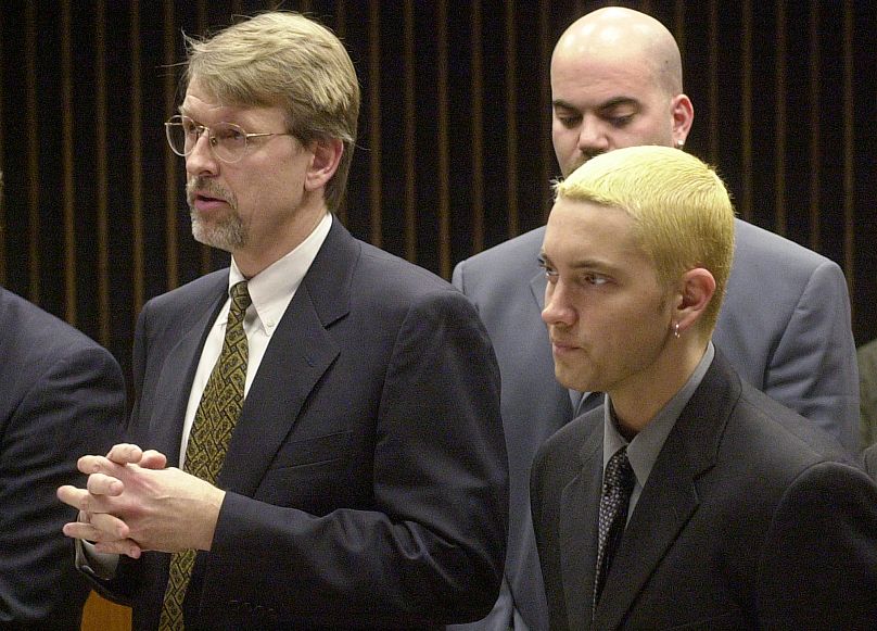 Eminem, right, listens to his attorney Walter Piszczatowski, left, address the judges in Mount Clemens, Mich., April 10, 2001 