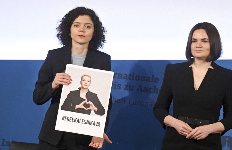 FILE - Tatsiana Khomich (left) who receives the Charlemagne Prize at City Hall on behalf of her sister, Maria Kalesnikava, in Aachen, Germany, Thursday, May 26, 2022.