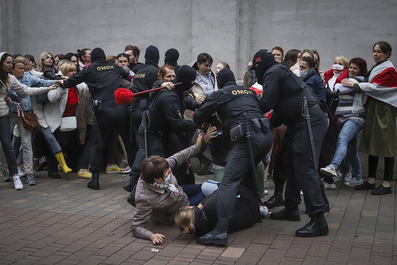 FILE - Police officers detain protesters during a rally in support of detained Belarusian opposition figure Maria Kalesnikava in Minsk, Belarus, on Tuesday, Sept. 8, 2020. 