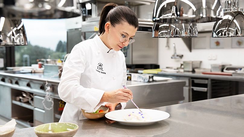 Chef Lucrèce Lacchio plating up in Le Berceau des Sens kitchen.
