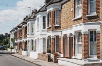 Row of typical British terraced houses in Barnes, an affluent residential area of London, famous for its village atomosphere.