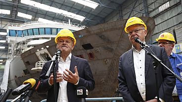 German Chancellor Olaf Scholz and Stephan Weil, Minister President of Lower Saxony, in a factory hall at Meyer Werft in Papenburg, Germany. 22 Aug. 2024.