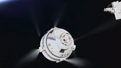 The unmanned Boeing Starliner capsule fires its thrusters as it pulls away from the International Space Station, September 6, 2024