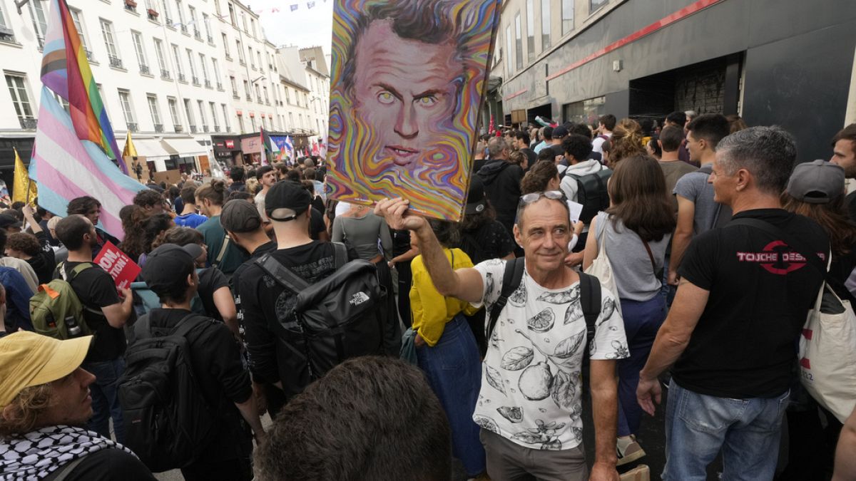 Prosteter with poster of President Emmanuel Macron, Paris, France September 7th 2024