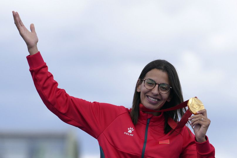 Morocco's Fatima Ezzahra El Idrissi poses with her gold medal after winning the women's marathon T12 at the 2024 Paralympics, Sunday, Sept. 8, 2024, in Paris, France.