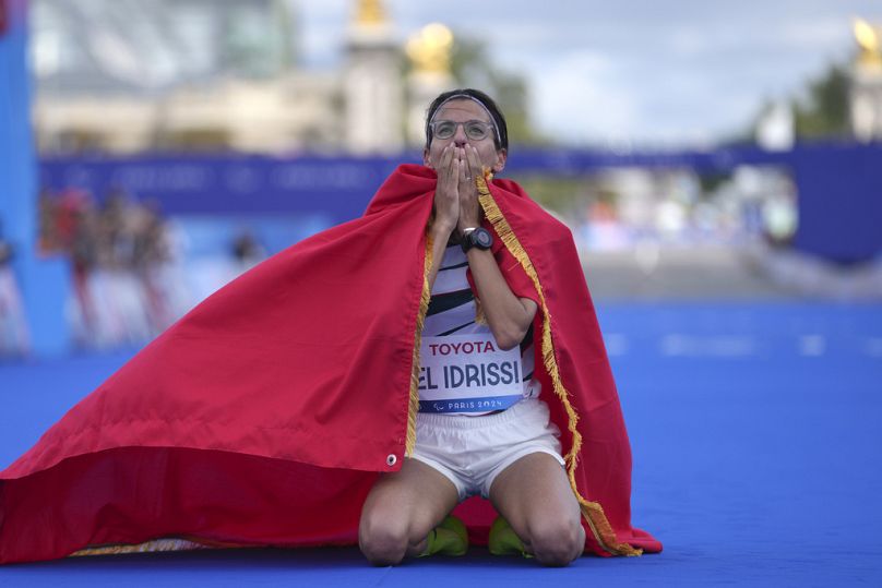 Morocco's Fatima Ezzahra El Idrissi celebrates after winning the women's marathon T12 at the 2024 Paralympics, Sunday, Sept. 8, 2024, in Paris, France.