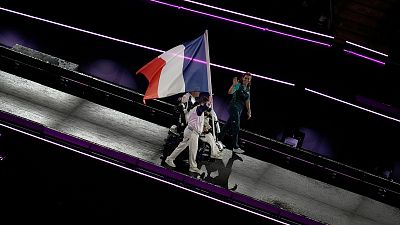 Members of the French delegation parade during the closing ceremony of the 2024 Paralympics in Paris, 8 September 2024