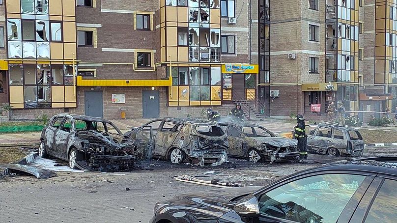 Firefighters extinguish burning cars in the courtyard of an apartment building after a missile attack by the Armed Forces of Ukraine on the city of Belgorod, September 2, 2024