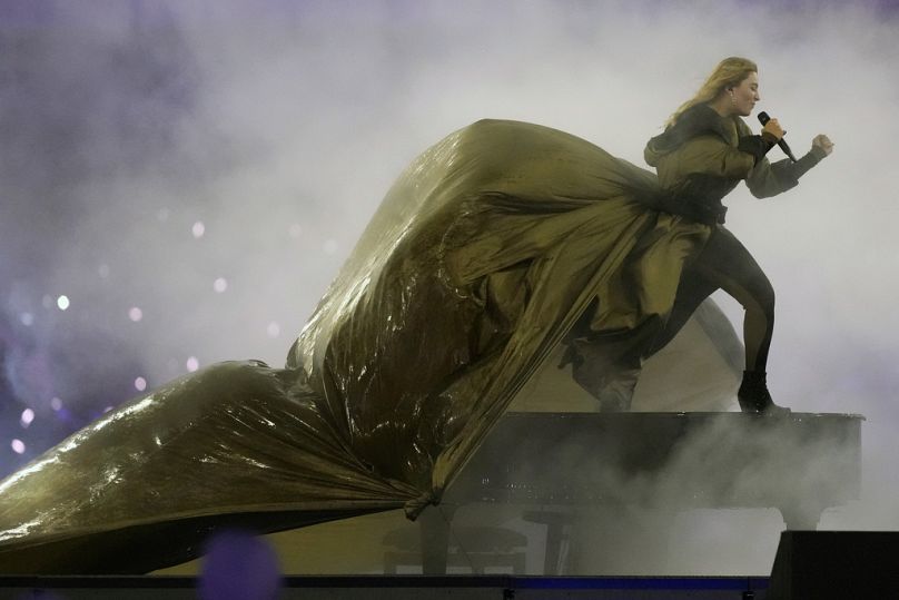 French singer Santa performs Johnny Hallyday's song ''Vivre pour le Meilleur'' during the closing ceremony for the 2024 Paralympics, Sunday, Sept. 8, 2024, in Paris, France.