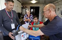 A man casts his ballot at his home in the Zheleznodorozhny district of Kursk, Russia, on Saturday, Sept. 7, 2024, during the three-day all Russia regional elections.