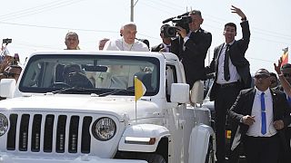 Pope Francis in a car, is welcomed in Dili, East Timor, Monday, Sept. 9, 2024.